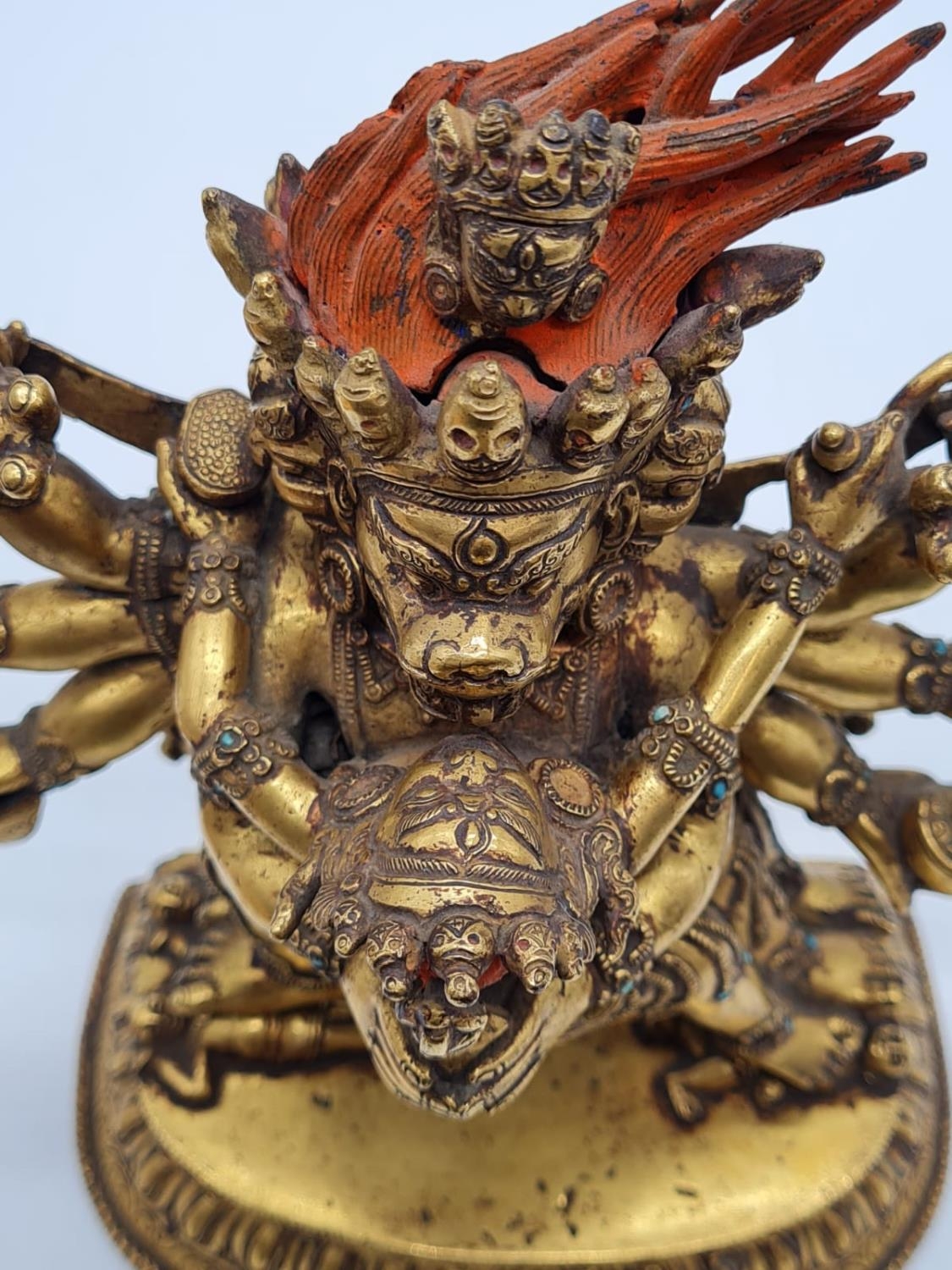 A very early Oriental gilt on bronze statue of a fertility god, weight