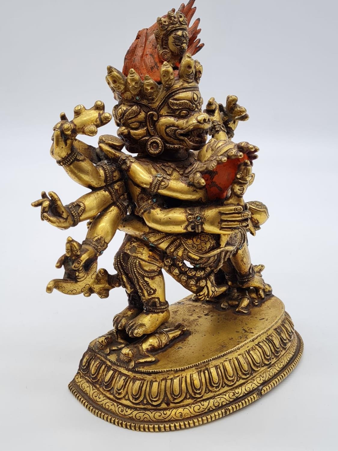 A very early Oriental gilt on bronze statue of a fertility god, weight ...