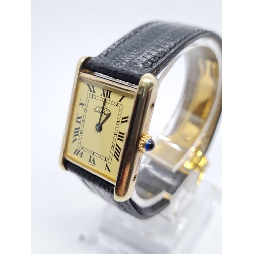Must De Cartier vintage gents watch with black leather strap, manual  winding 22mm x 25mm case and de