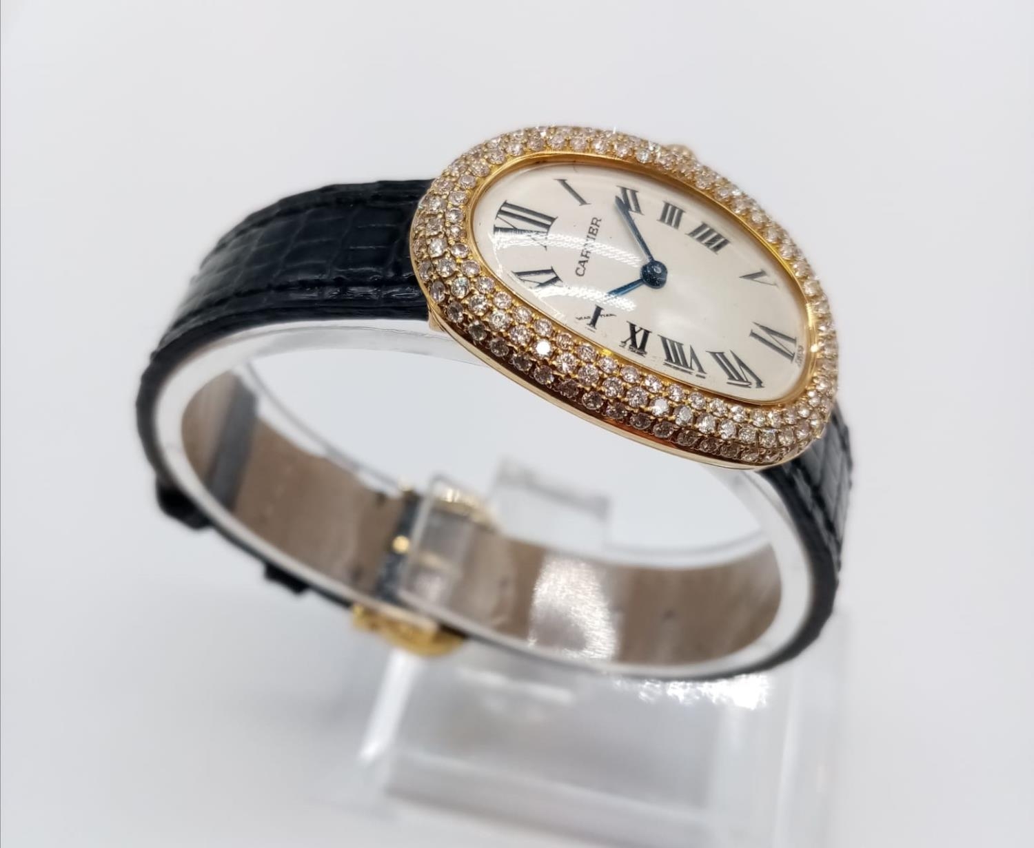Vintage 18ct gold Cartier ladies quartz watch with oval face and diamond encrusted bezel, Cartier bl
