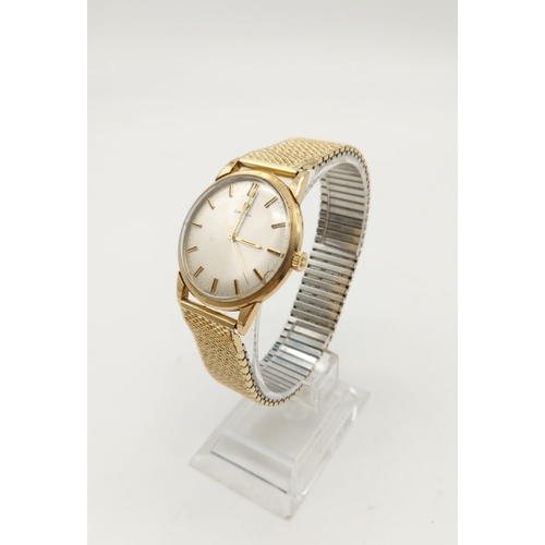 49 - A 1960s Omega 5 Series Gold Watch. Gold plated concertina strap. Gold case - Silver tone dial. Inscr... 