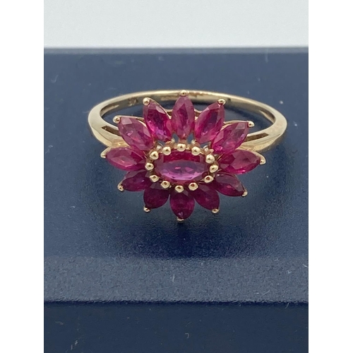 21 - Ladies 9 carat GOLD and Topaz cluster ring.Having pink Topaz in flower formation with gold bead deta... 