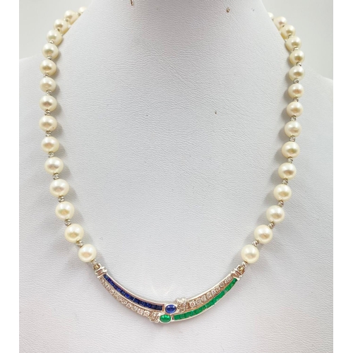 33 - A BEAUTIFULLY CRAFTED PEARL AND DIAMOND NECKLACE WITH CHANNEL SET EMERALDS AND DIAMONDS IN 18K WHITE... 