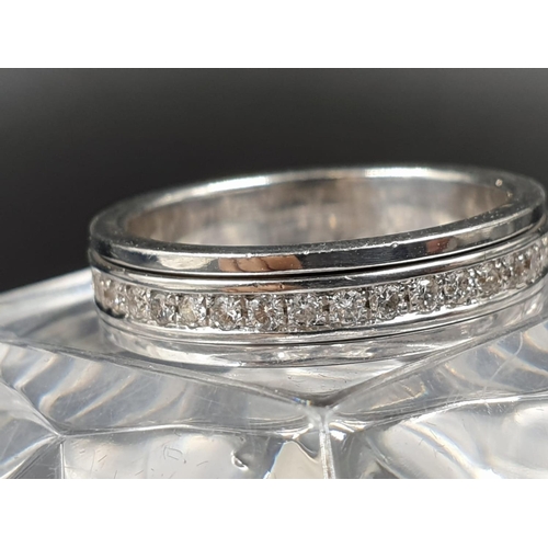 22 - An 18K White Gold Diamond Eternity Ring. Size O.
7.27g