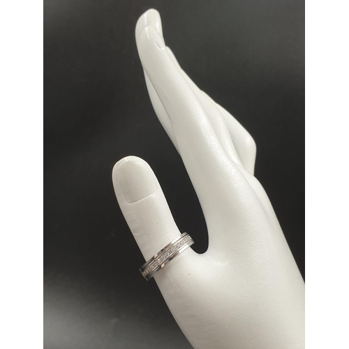 22 - An 18K White Gold Diamond Eternity Ring. Size O.
7.27g
