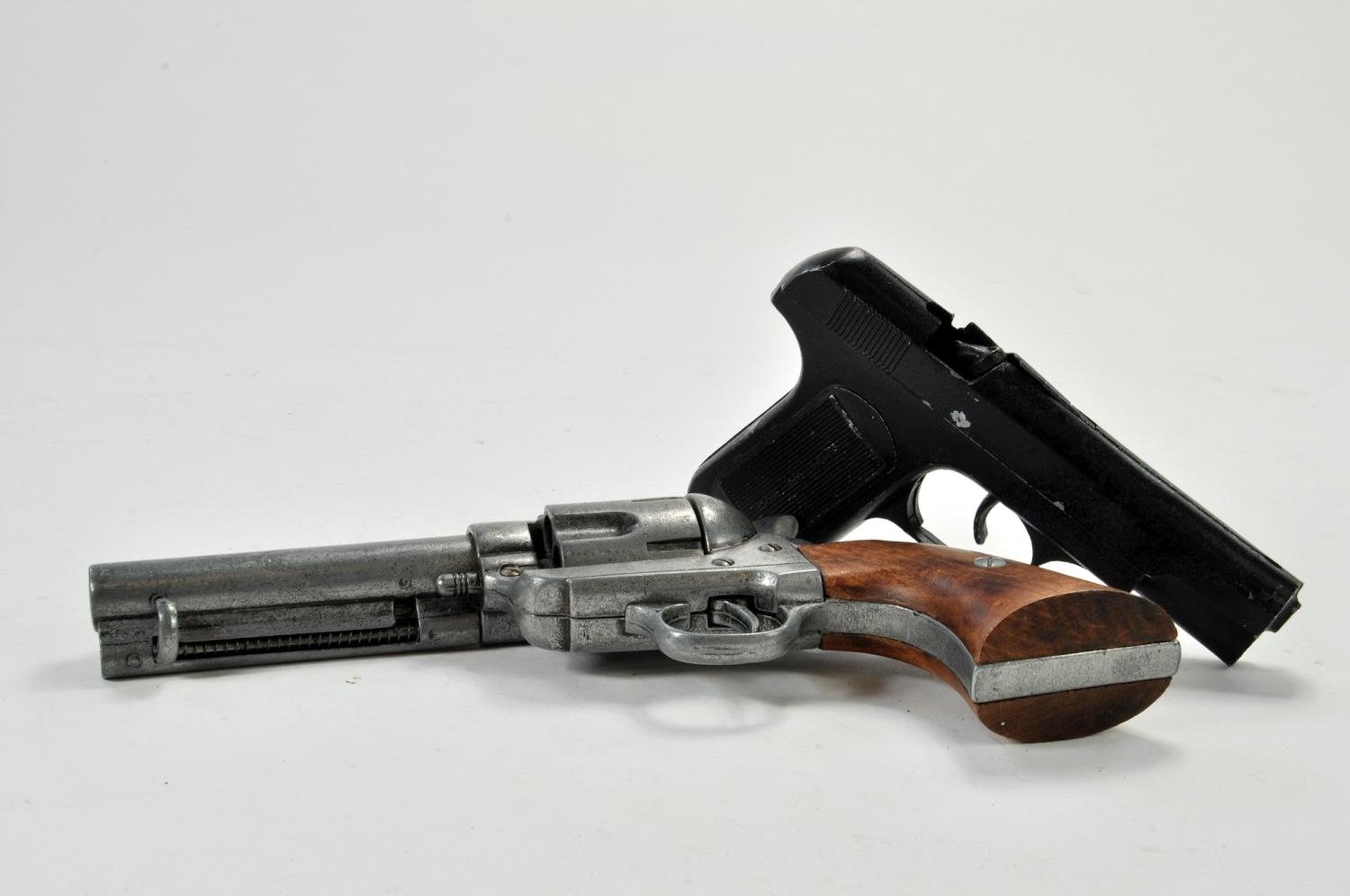 Duo of realistic novelty prop replica toy guns, one requires attention.