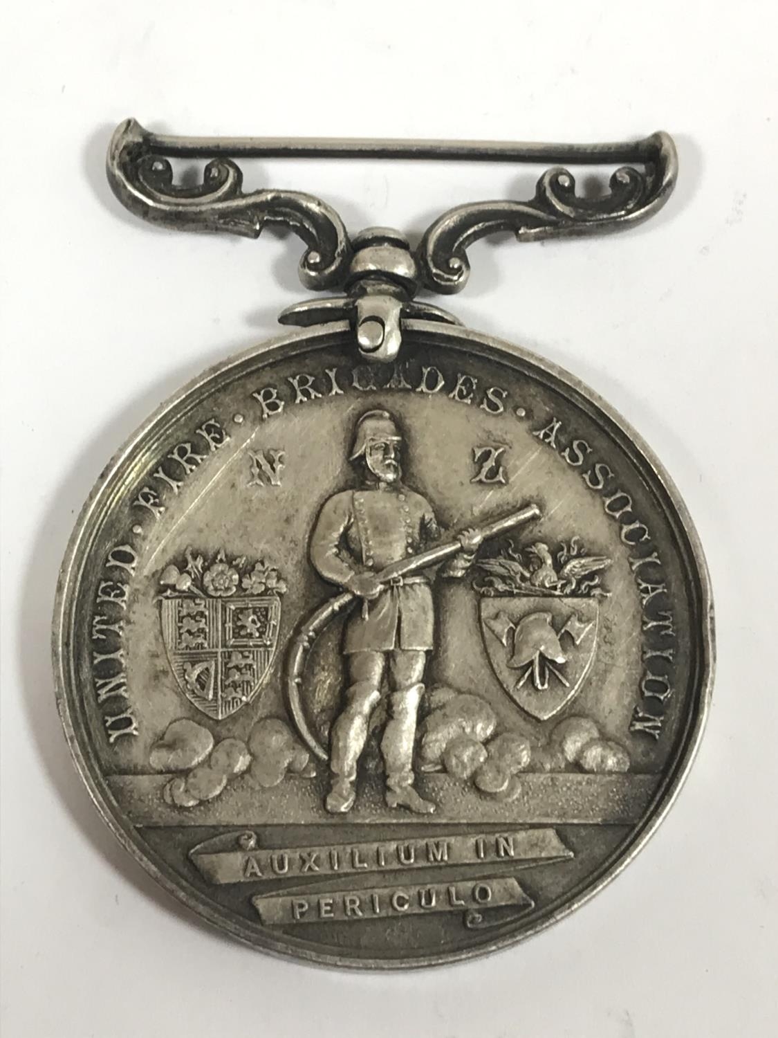 A VICTORIAN FIRE BRIGADE ASSOCIATION MEDAL. A United Fire Brigades Association medal, the obverse wi