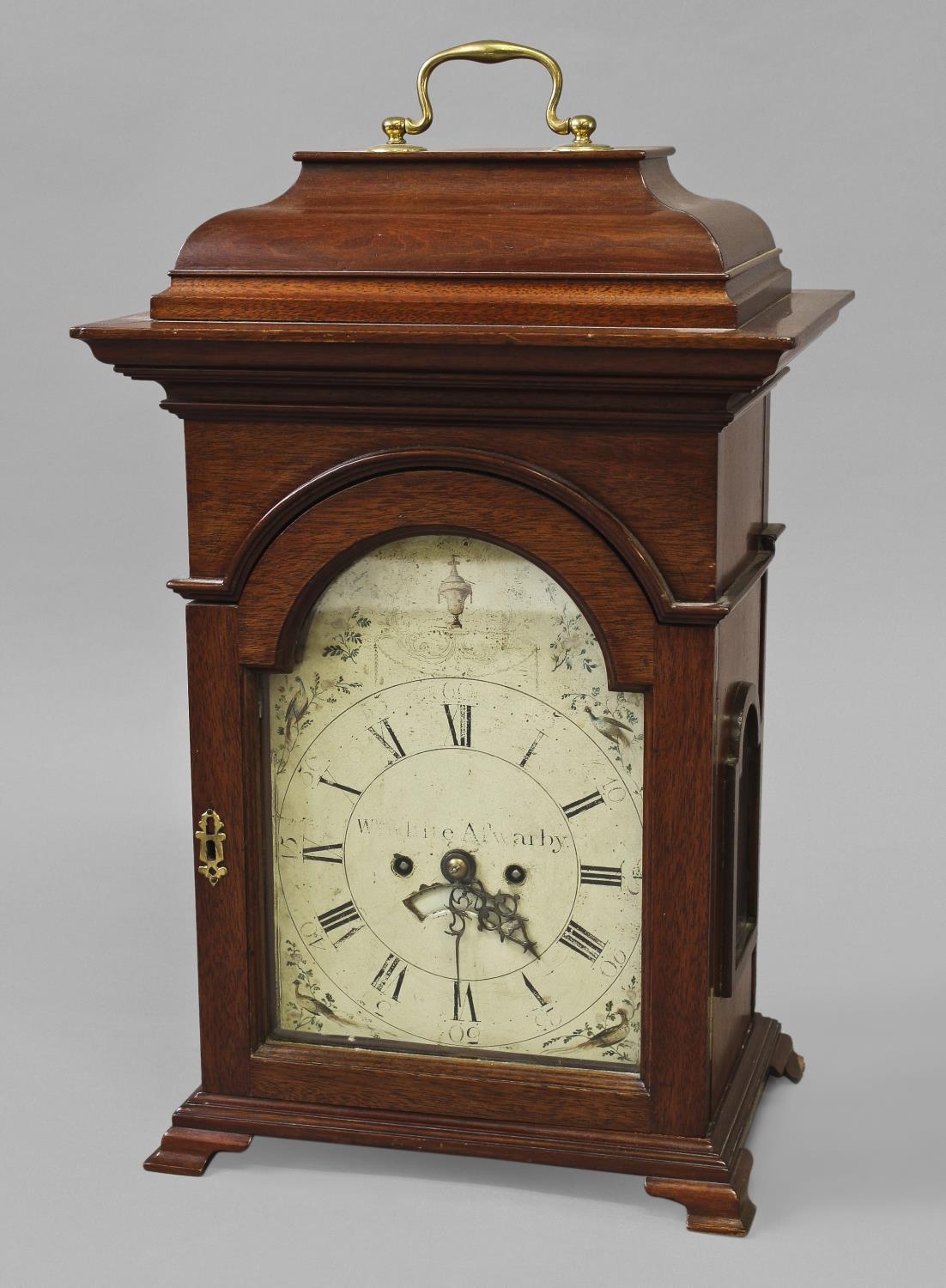 A MAHOGANY CASED BRACKET CLOCK WITH A PAINTED DIAL, the arched dial