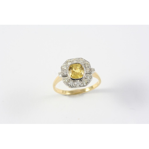 1170 - A YELLOW SAPPHIRE AND DIAMOND CLUSTER RING the oval-shaped yellow sapphire is set within a surround ... 