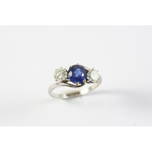 1418 - A SAPPHIRE AND DIAMOND THREE STONE RING the circular-cut sapphire is set with two brilliant-cut diam... 
