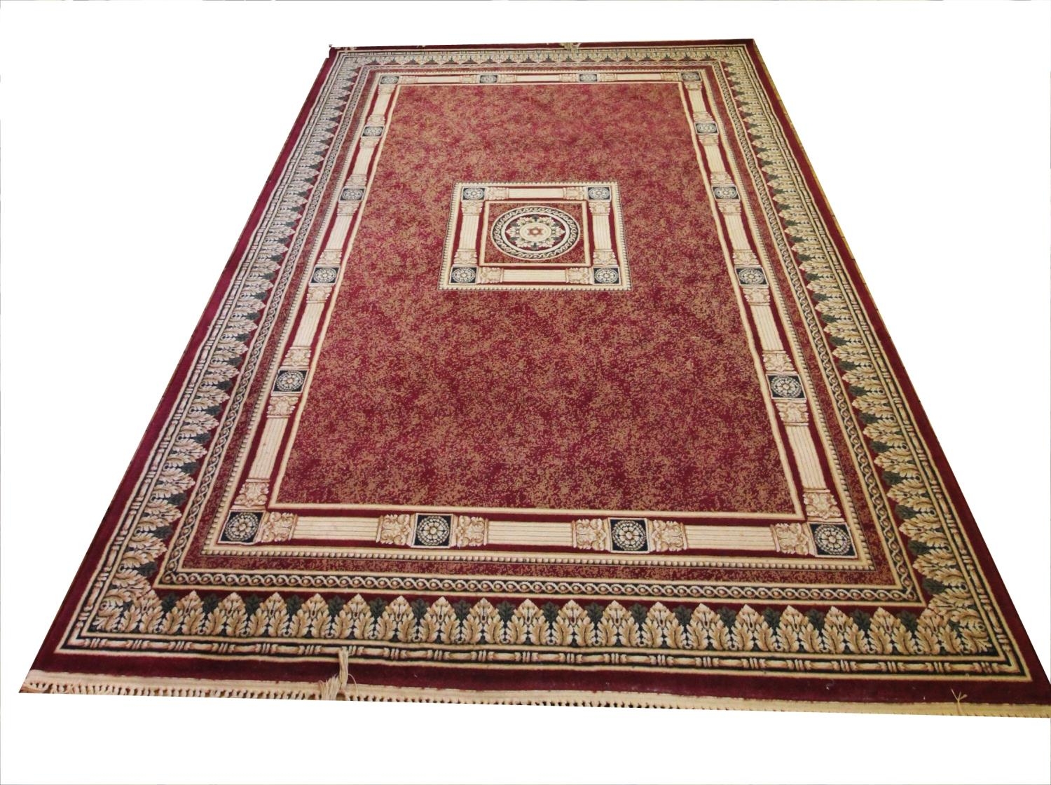 A Sarook Kashan silk rug, of neo-classical design against a burgundy