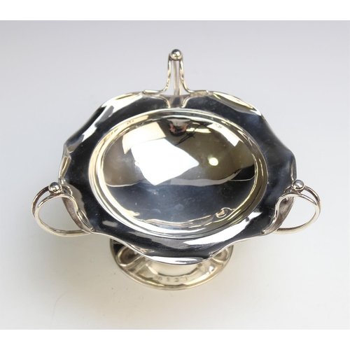 34 - An Art Nouveau silver tazza by Hukin & Heath, Birmingham 1906,of circular form with shaped rim with ... 