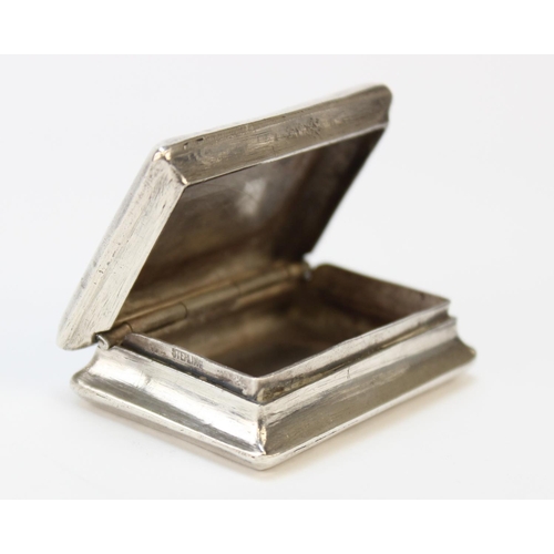 38 - A Victorian/Edwardian silver snuff box, circa 1900, of rectangular form with chased floral decoratio... 
