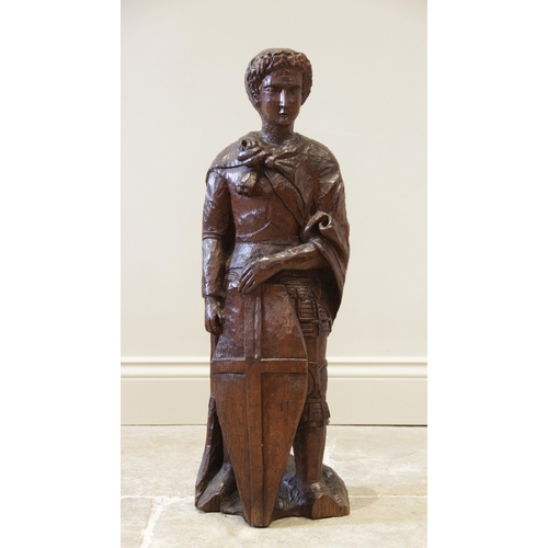 A late 19th century carved oak figure of St George, after Do... | Barnebys
