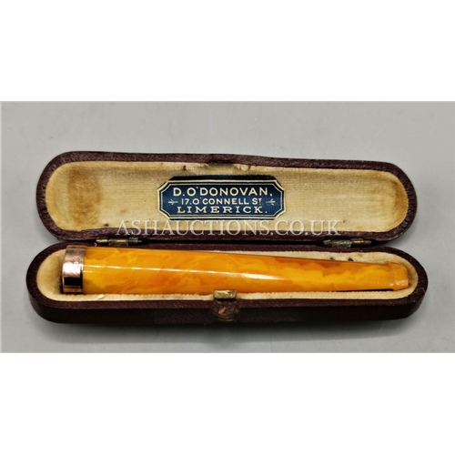 63 - PRESENTED AS A 9ct GOLD RIMMED AMBER CHEROOT HOLDER (Hallmarked 1928)( Original Irish Case)