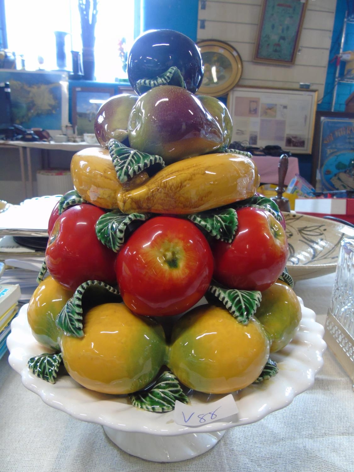 A large ceramic fruit bowl center piece (slight damage). 36cm tall
