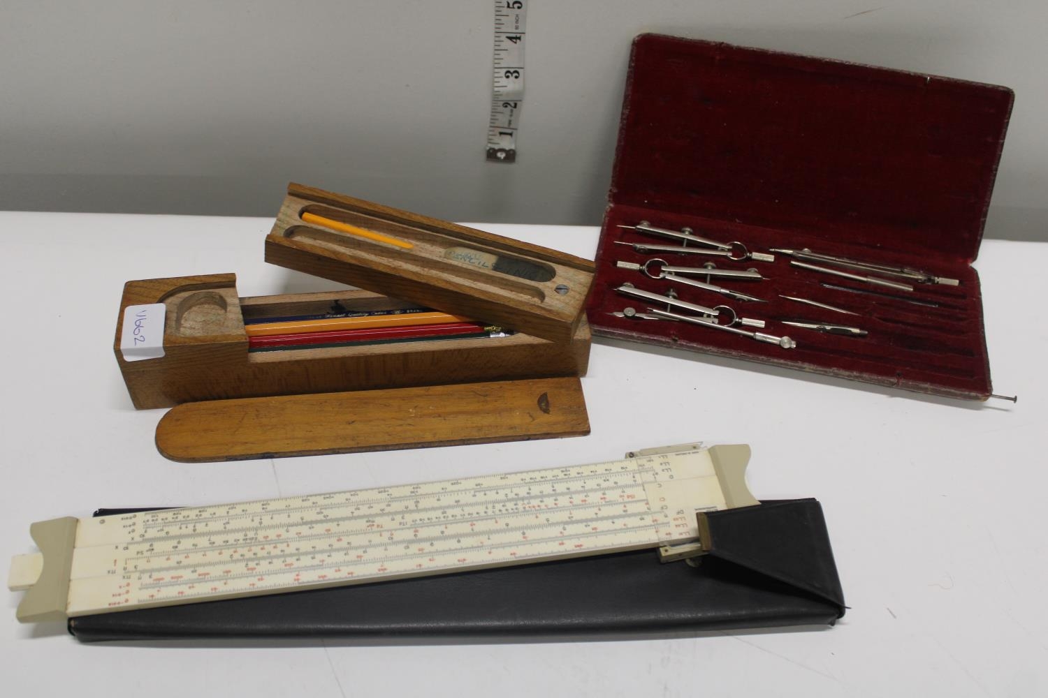 A vintage wooden pencil case & technical drawing instruments