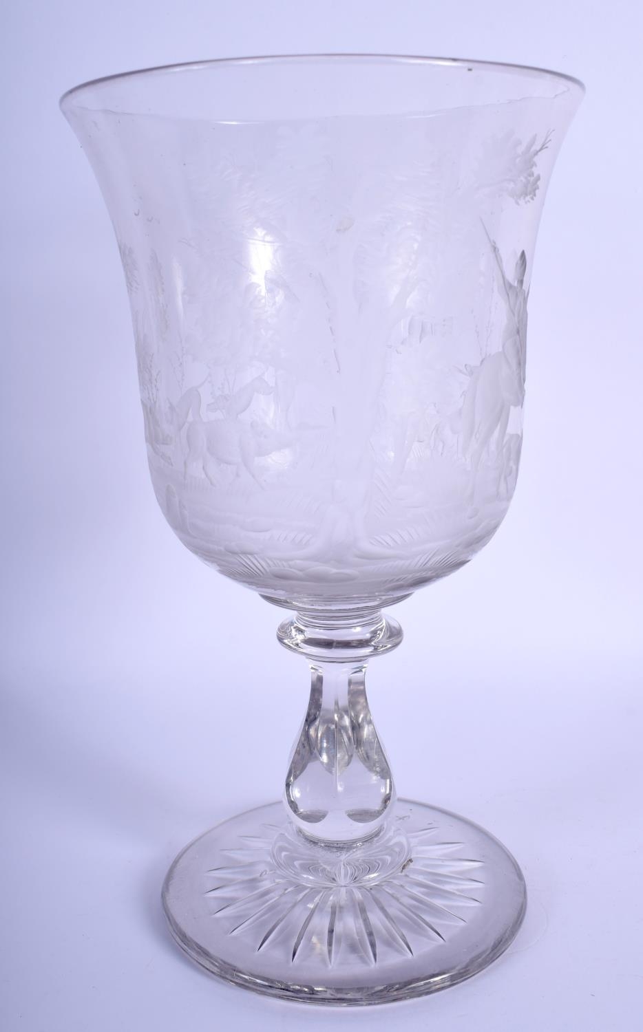 A GOOD LARGE ANTIQUE CRYSTAL GLASS GOBLET engraved with hunting scenes