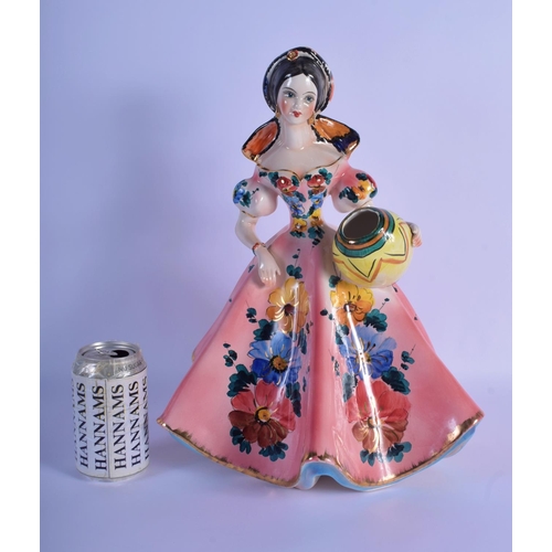 11 - A 1950S ITALIAN CERAMIC FIGURE OF A STANDING FEMALE GYPSY GIRL modelled holding an urn, painted with... 