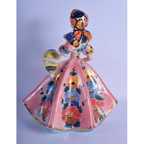 11 - A 1950S ITALIAN CERAMIC FIGURE OF A STANDING FEMALE GYPSY GIRL modelled holding an urn, painted with... 