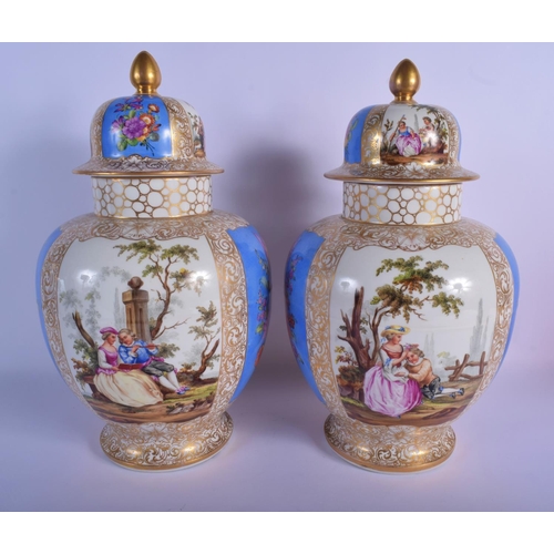 43 - A LARGE PAIR OF 19TH CENTURY GERMAN AUGUSTUS REX VASES AND COVERS painted with lovers. 37 cm x 18 cm... 