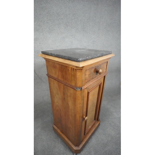 27 - A late 19th century French walnut pedestal cabinet with marble top above frieze drawer and panel doo... 