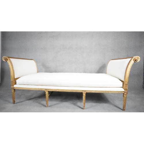 433 - A Louis XVI giltwood daybed in the style of JEAN-BAPTISTE SENE. With fitted cushion, carved and gild... 