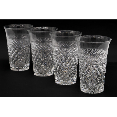 188 - Four heavy hand cut lead crystal water glasses with cross hatched design and star cut base, flared r... 