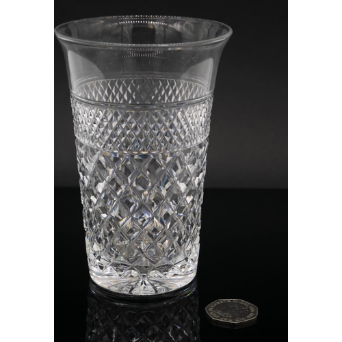 188 - Four heavy hand cut lead crystal water glasses with cross hatched design and star cut base, flared r... 