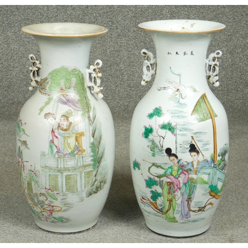 201 - Two 19th century Famille Rose hand painted porcelain vases, one side decorated with a temple scene t... 