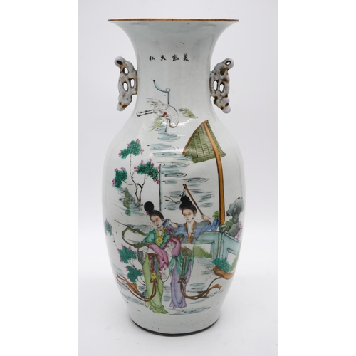 201 - Two 19th century Famille Rose hand painted porcelain vases, one side decorated with a temple scene t... 