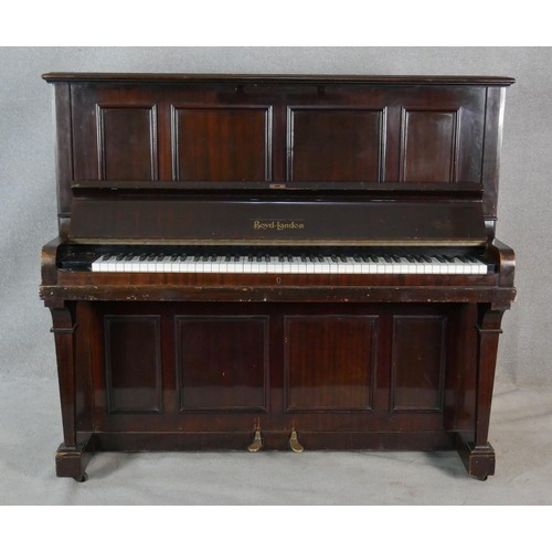 23 - A Boyd of London mahogany cased upright piano with maker's mark to the iron frame. H.131.5 W.148 D.6... 