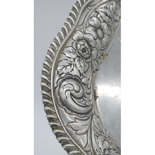 145 - An American repousse silver tray by Theodore B Starr. The edge decorated with a stylised foliate and... 