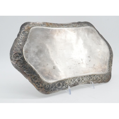 145 - An American repousse silver tray by Theodore B Starr. The edge decorated with a stylised foliate and... 