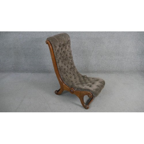 276 - A Victorian mahogany framed nursing chair in deep buttoned velour upholstery.