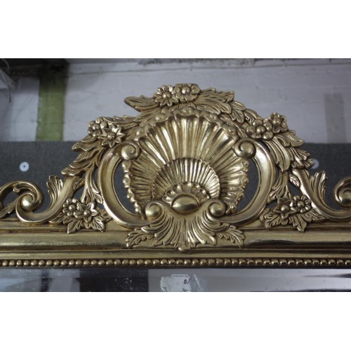 160 - A full height gilt framed pier mirror with arched plate in moulded and beaded frame with shell crest... 