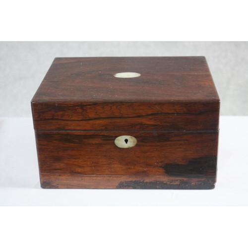 191 - A Victorian rosewood dressing box. With red velvet lining and mother of pearl cartouche. Contains cu... 
