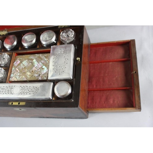 191 - A Victorian rosewood dressing box. With red velvet lining and mother of pearl cartouche. Contains cu... 
