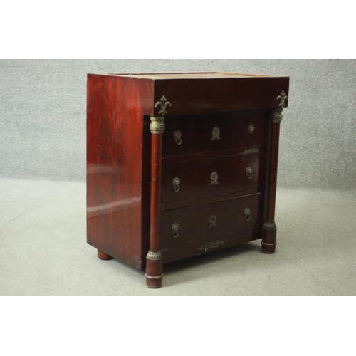 231 - An Empire style ormolu mounted mahogany chest of three long drawers flanked by pilasters on turned f... 
