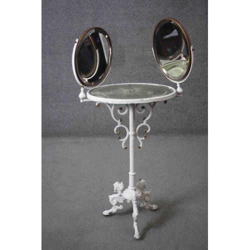 279 - A 19th century wrought iron dressing table with twin bevelled and adjustable vanity mirrors above et... 