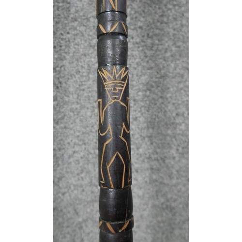 243 - A Polynesian hardwood and metal ceremonial staff with trident and animal hair detail. Carved detaili... 