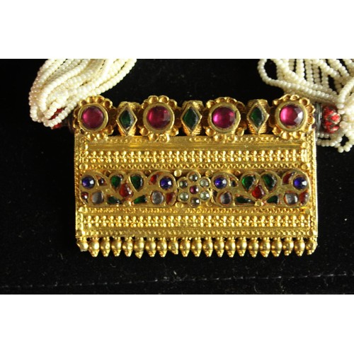 71 - An early 20th century Indian yellow metal Timaniya, (Indian necklace, tests as 22 carat gold). Set w... 