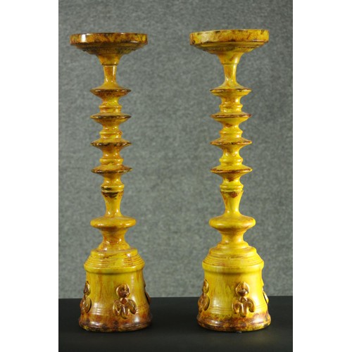 72 - A pair of large early 20th century Turkish Canakkale style yellow and brown speckle glaze candlestic... 