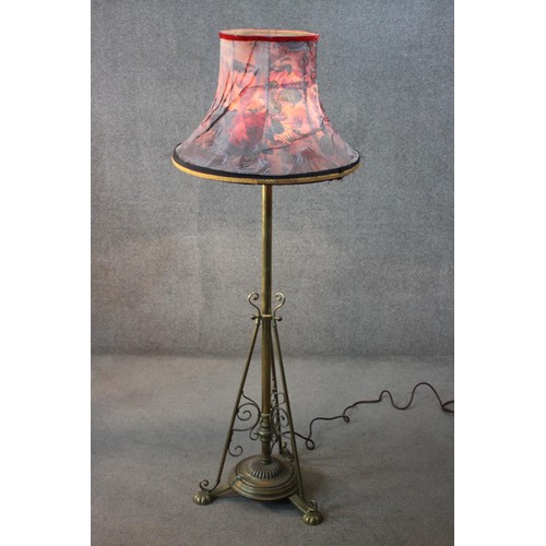 132 - Lamp standard, 19th century brass converted to electricity with original fringed shade along with an... 