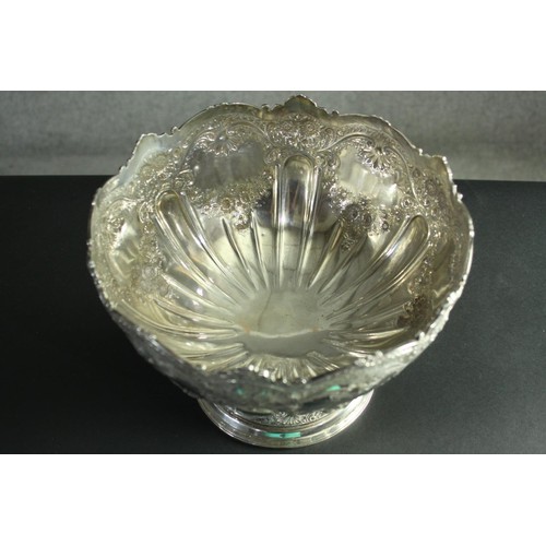 1 - A large Victorian repousse silver pedestal punch bowl. Decorated all over with roses, floral garland... 