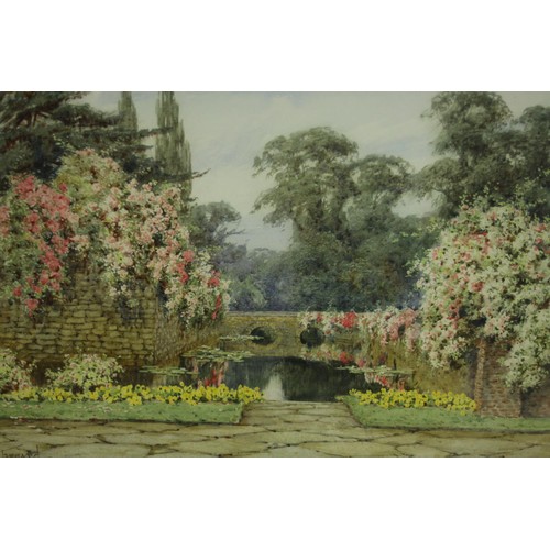 474 - Lilian Stannard (British 1877-1944) watercolour, a formal pond with a bridge and waterlilies, signed... 
