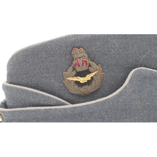 58 - Two vintage military caps with retailers box. A RAF Cold War period Air Officers side cap by Gieves ... 