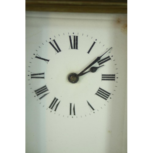 147 - An early 20th century brass carriage clock, white enamel dial and black roman numerals. (No key) H.1... 