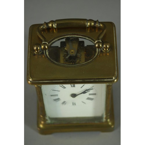 147 - An early 20th century brass carriage clock, white enamel dial and black roman numerals. (No key) H.1... 