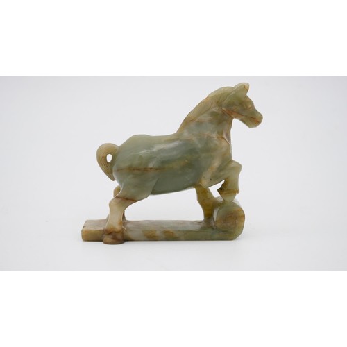395 - A Chinese carved Jade horse on scroll base. H.11 W.11 D.3cm